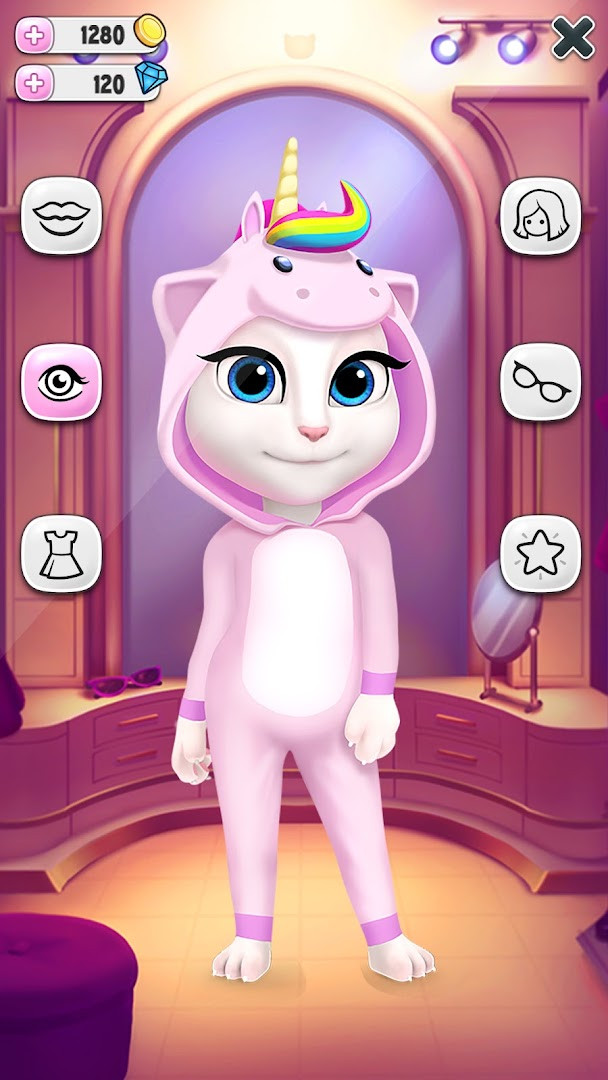 My Talking Angela dance party screen with a rainbow unicorn theme.
