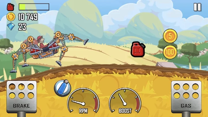 In-game view of a jeep driving up a rocky hill with a coin trail.